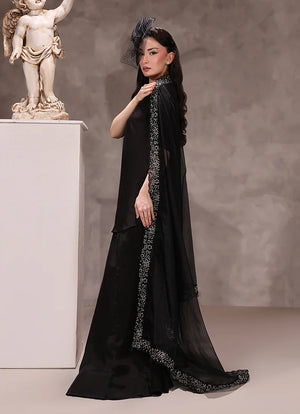 woman posing in black silk dress buraqstore with luxury three piece styling