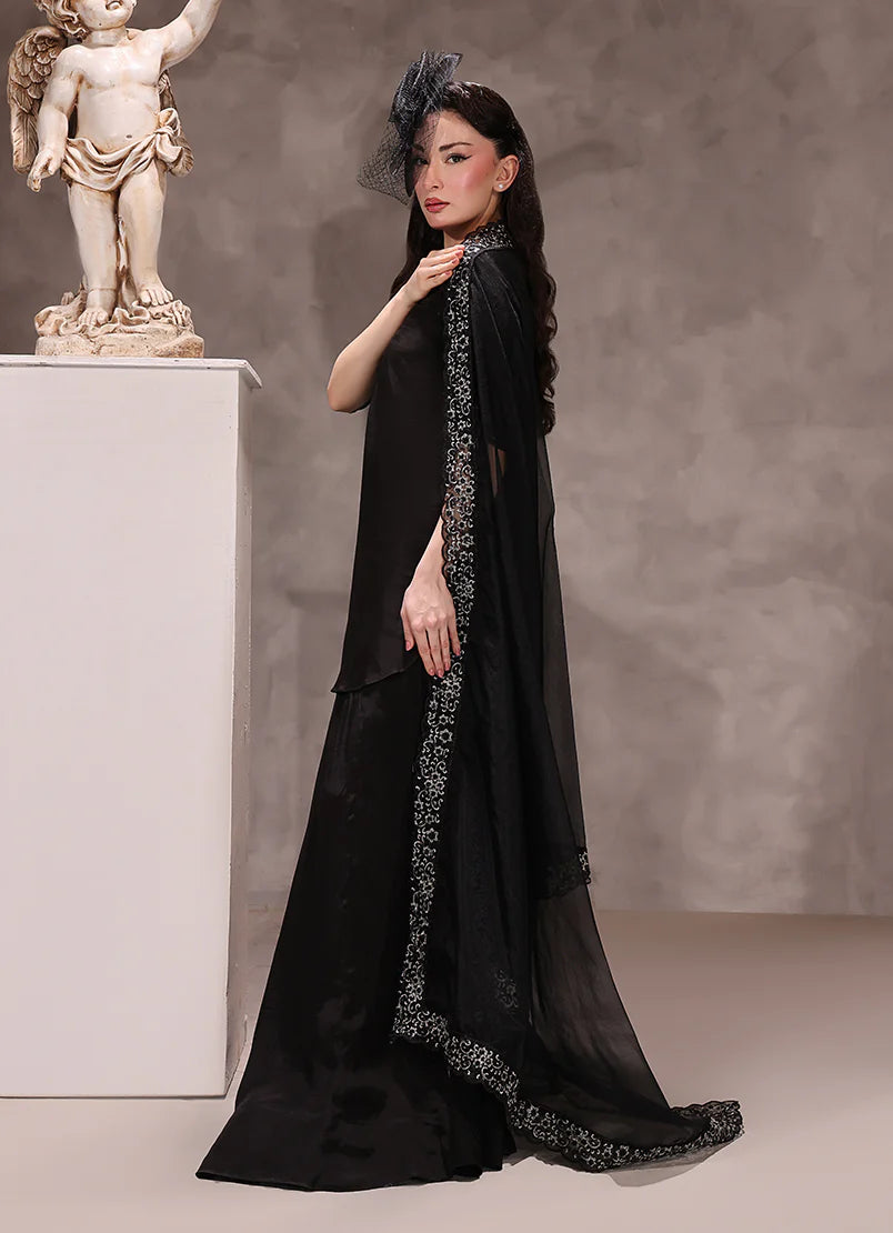 woman posing in black silk dress buraqstore with luxury three piece styling