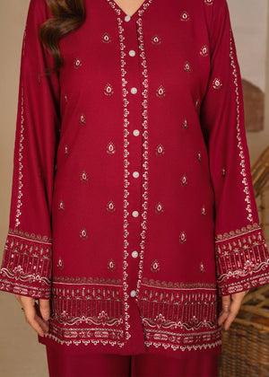 Model wearing maroon color dress, side view showing the fit of the embroidered lawn 2PC, Buraqstore