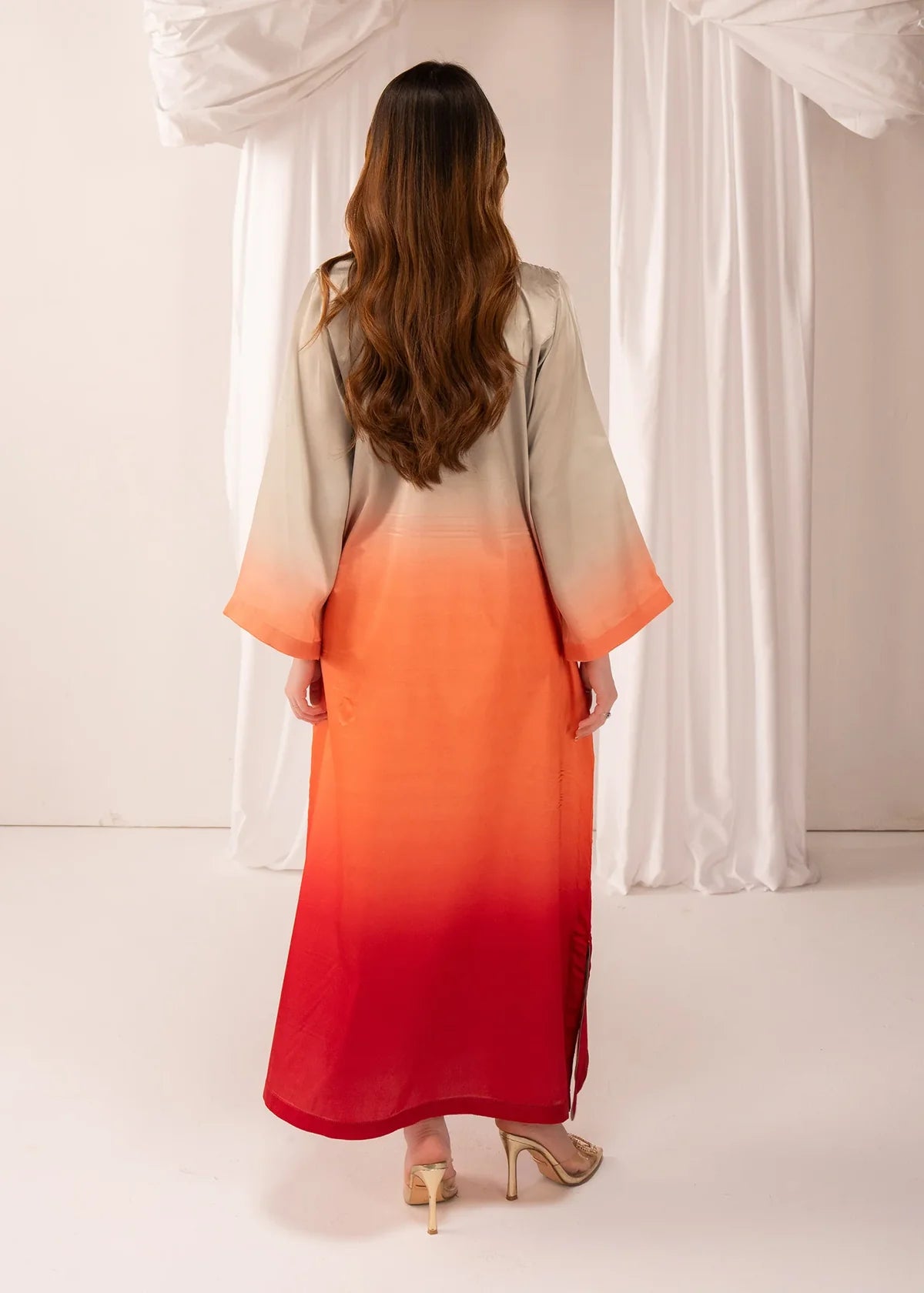Women wearing multi color dress, close-up of the hand embellishment on the silk fabric, Buraqstore