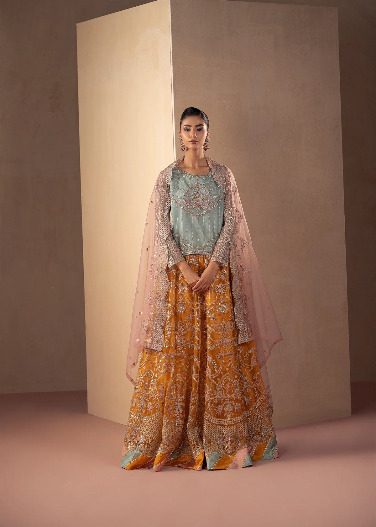 Model wearing multi color dress, an embroidered and embellished shirt with sharara, front view from Buraqstore
