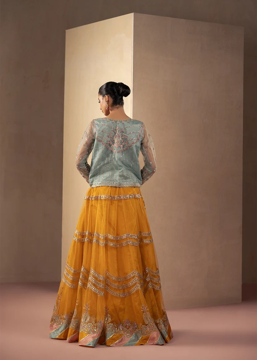Woman wearing multi color dress, close-up of the embroidery and embellishment on the shirt, Buraqstore