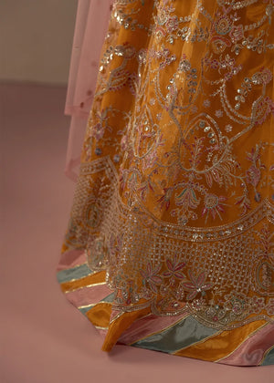 Model wearing multi color dress, side view showing the flare of the sharara, Buraqstore