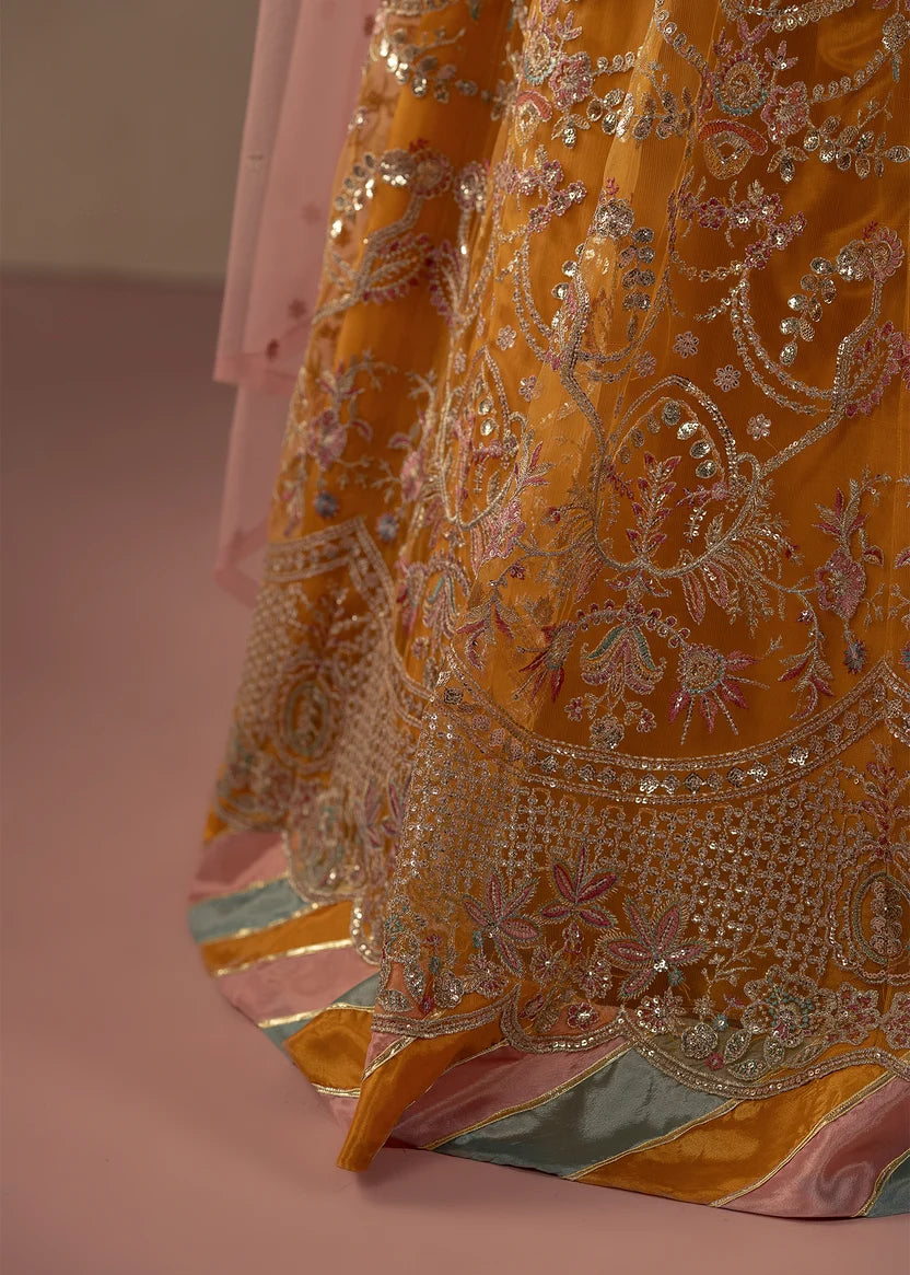 Model wearing multi color dress, side view showing the flare of the sharara, Buraqstore