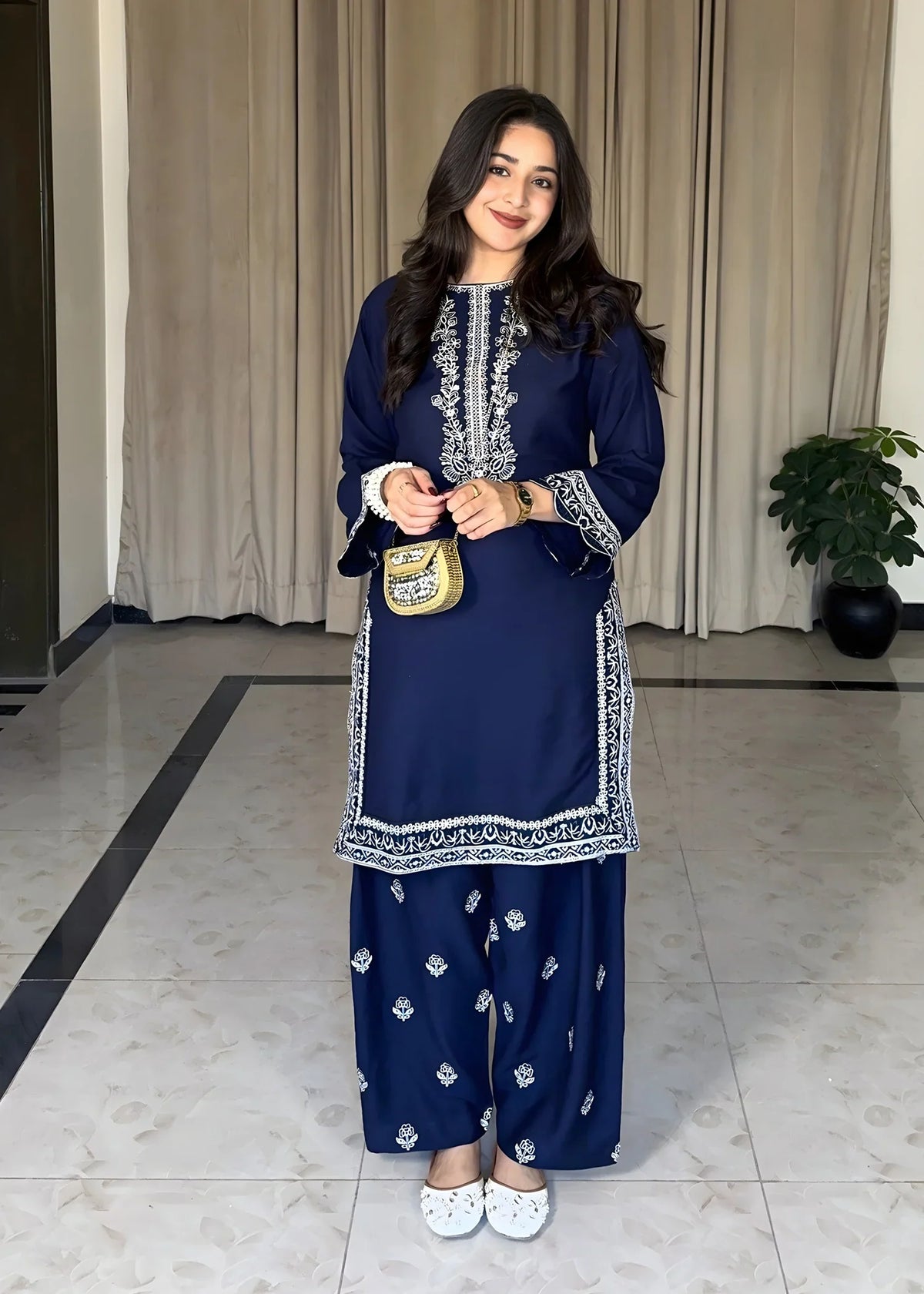 Model wearing navy blue dress, embroidered lawn 2PC set, front view from Buraqstore
