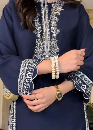 Women wearing navy blue dress, close-up of the embroidery on the lawn shirt, Buraqstore