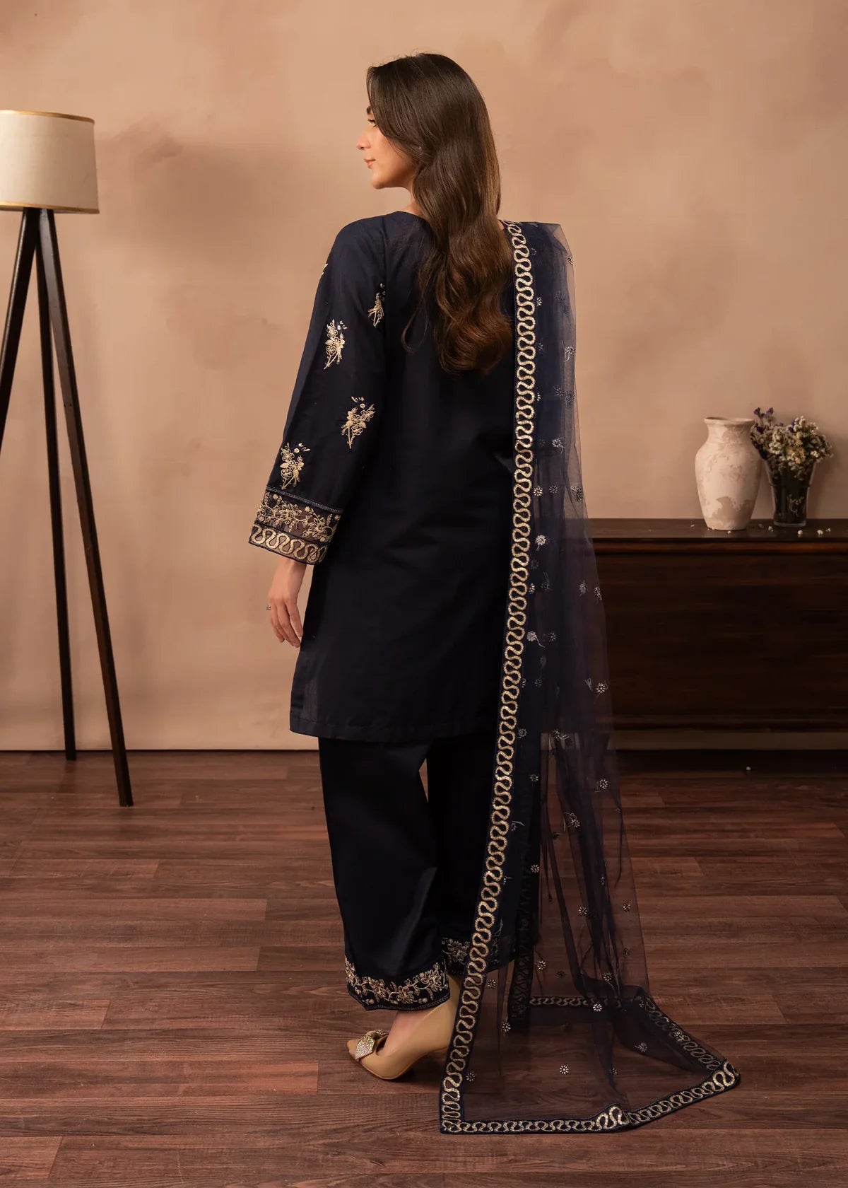 Women wearing navy blue dress pakistani, close-up of the embroidery on the lawn shirt, Buraqstore