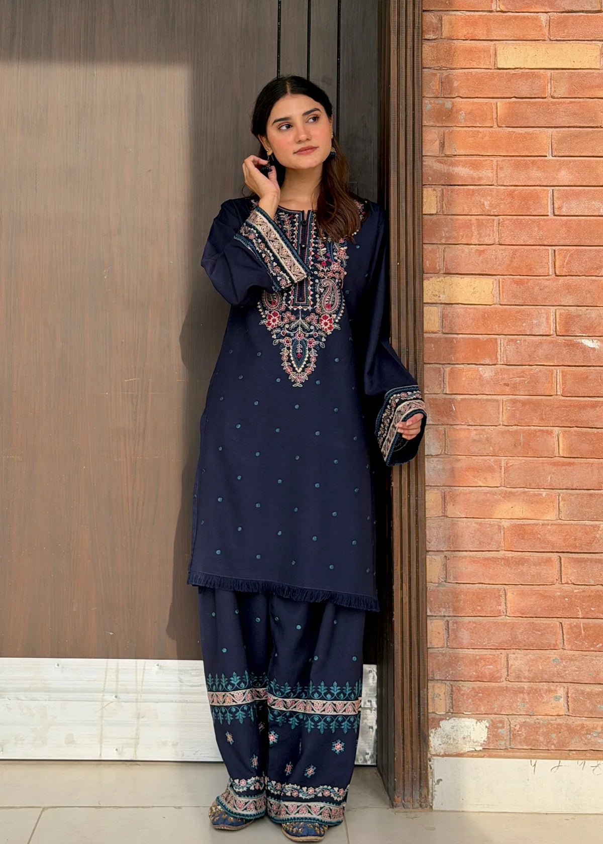 Women wearing navy blue dress pakistani, close-up of the embroidery on the viscose shirt, Buraqstore