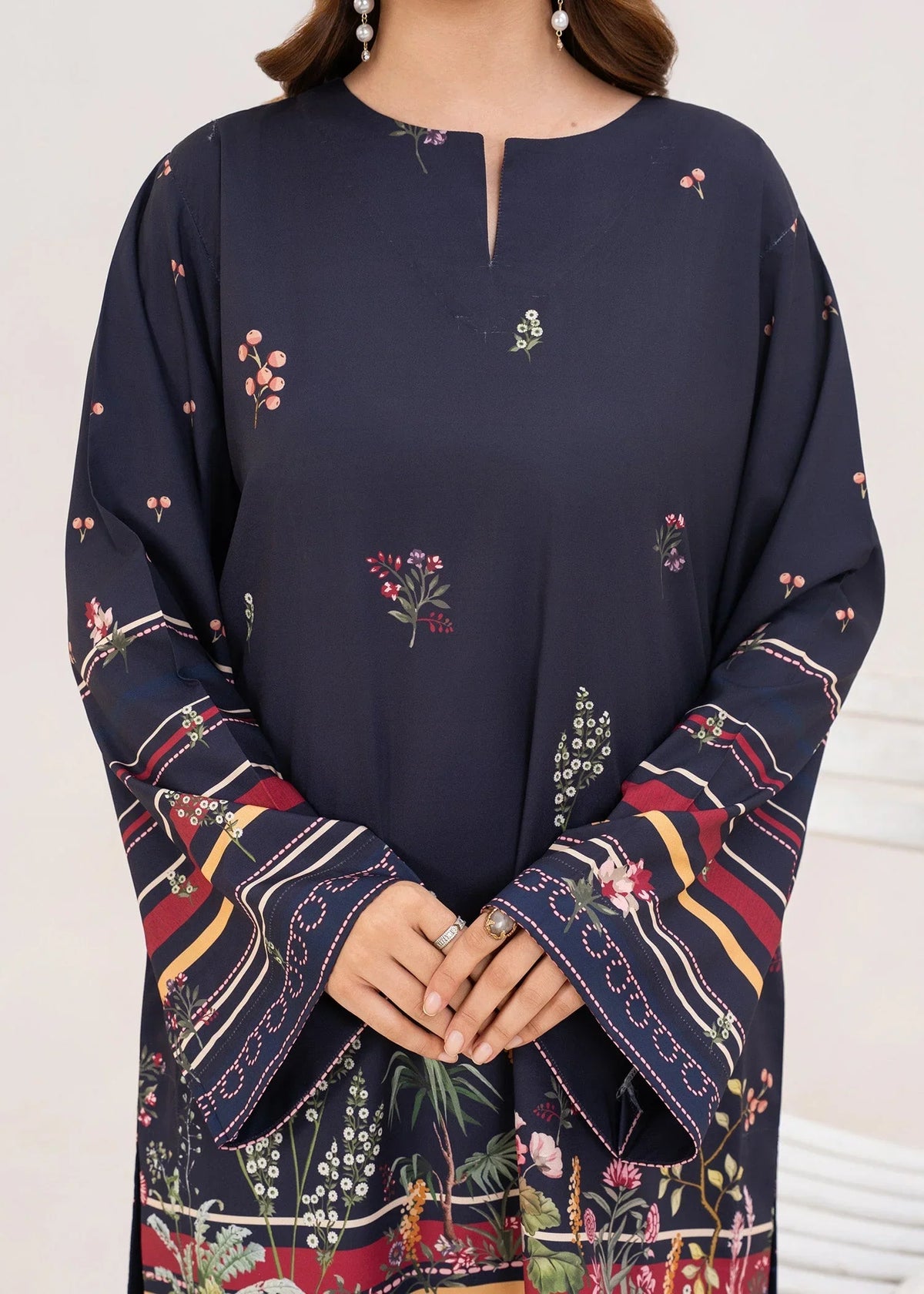 Model wearing navy blue lawn co ord set for women, close-up of the print on the poly lawn top and bottom, Buraqstore