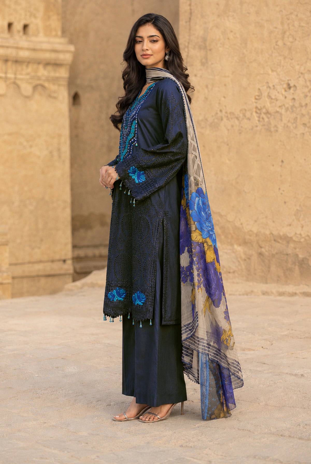 Model wearing navy blue chikankari shirt with plain dyed viscose trouser, side view of the stitched 3PC at Buraqstore