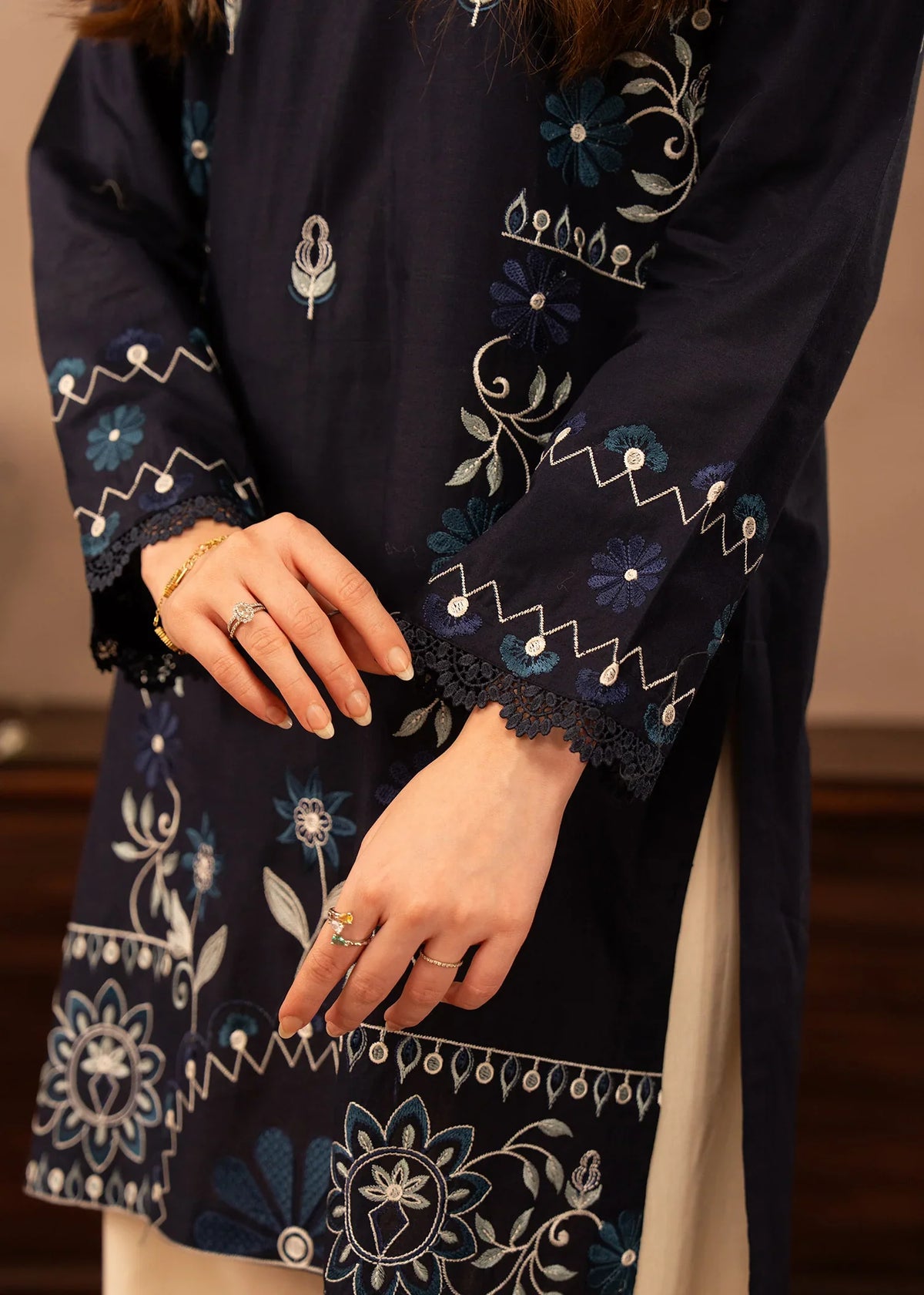 Model wearing navy blue dress pakistani, side view showing the fit of the embroidered lawn 2PC, Buraqstore
