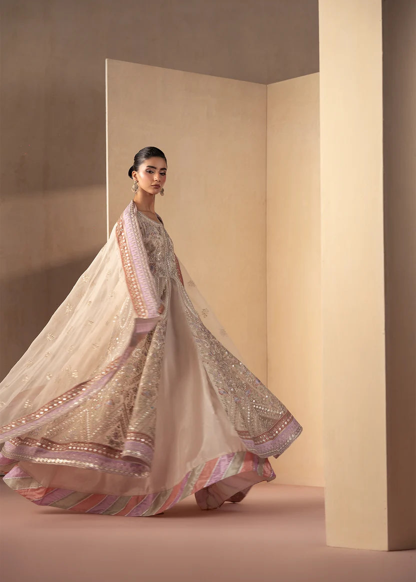 Model wearing off white dress, side view showing the flow of the maxi, Buraqstore