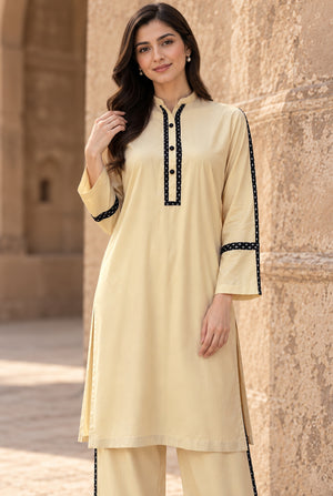 Women wearing off-white stitched linen dress 2PC in side profile showing the elegant fall, linen dress design at Buraqstore