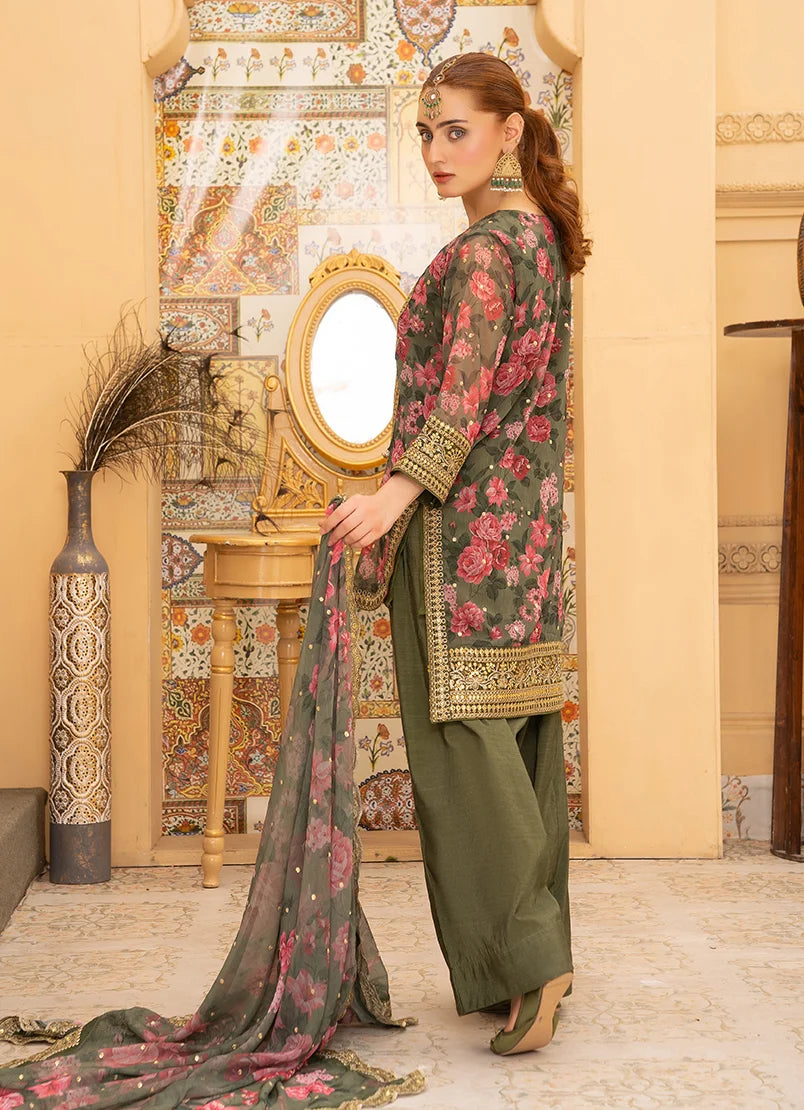 Women wearing green dress design, close-up of the gotta patti and tassel detailing on the silk shirt, Buraqstore