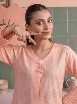 Model wearing peach color dress, side view showing the fit of the shirt and trouser 2PC, Buraqstore