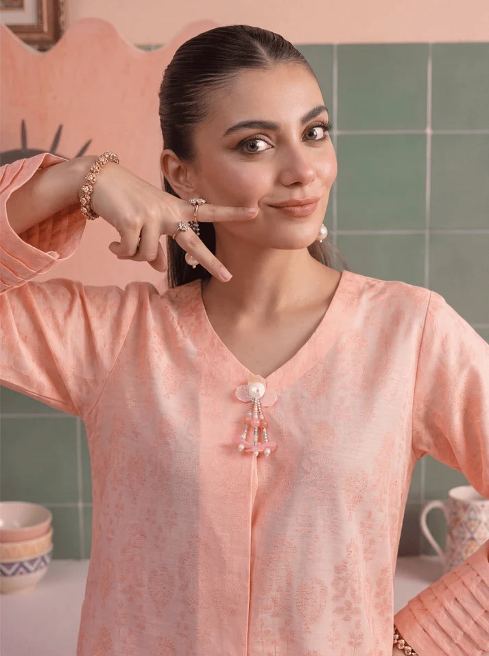 Model wearing peach color dress, side view showing the fit of the shirt and trouser 2PC, Buraqstore