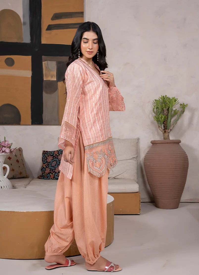 Model wearing peach color dress, side view showing the fit of the jacquard 2-piece set, Buraqstore