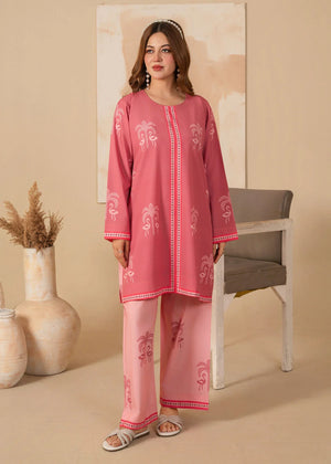 Model wearing pink dress design for girl, printed grip 2PC set, front view from Buraqstore
