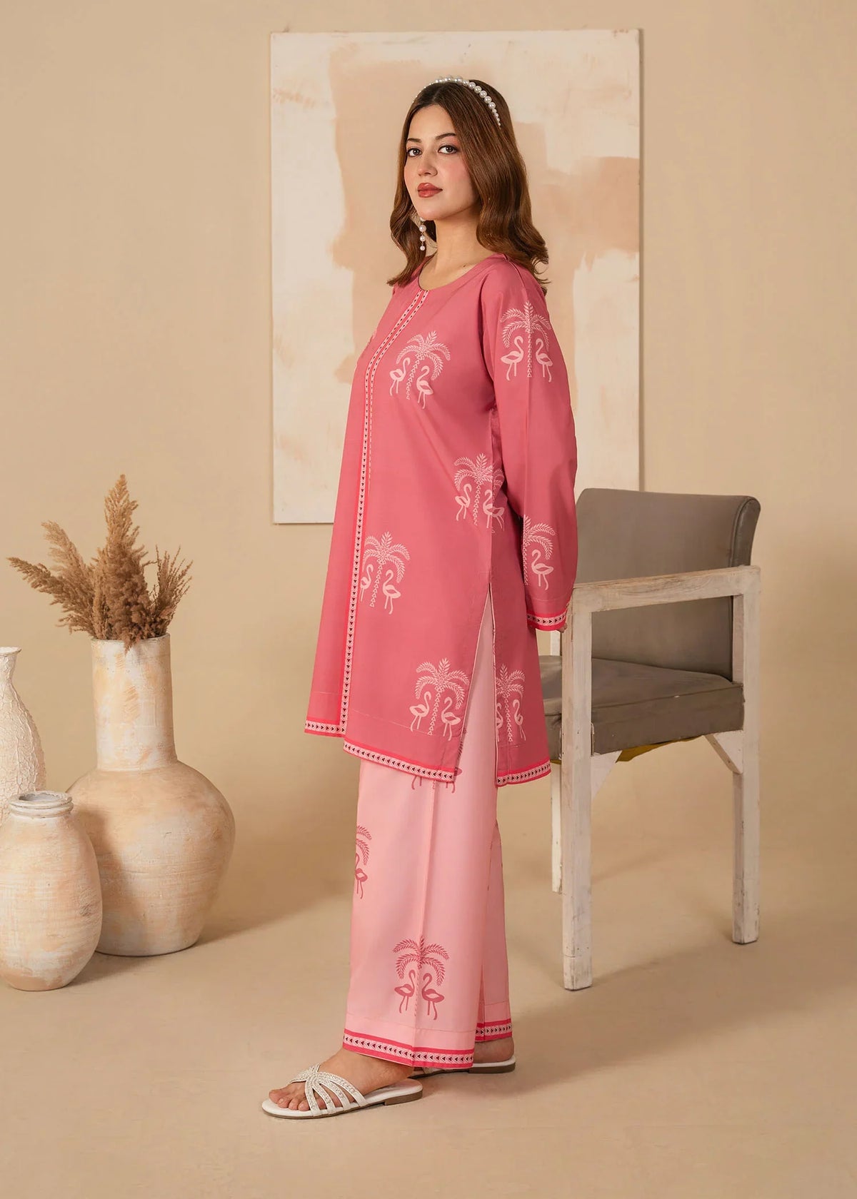 A girl dressed in pink dress design for girl, close-up of the print on the grip fabric, Buraqstore