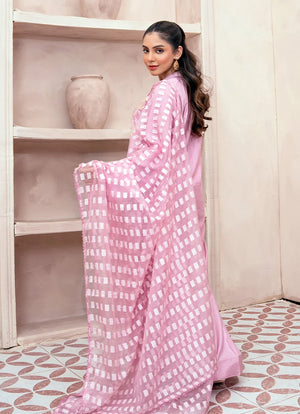 Model wearing pink dress design, side view showing the fall of the raw silk 3-piece set, Buraqstore