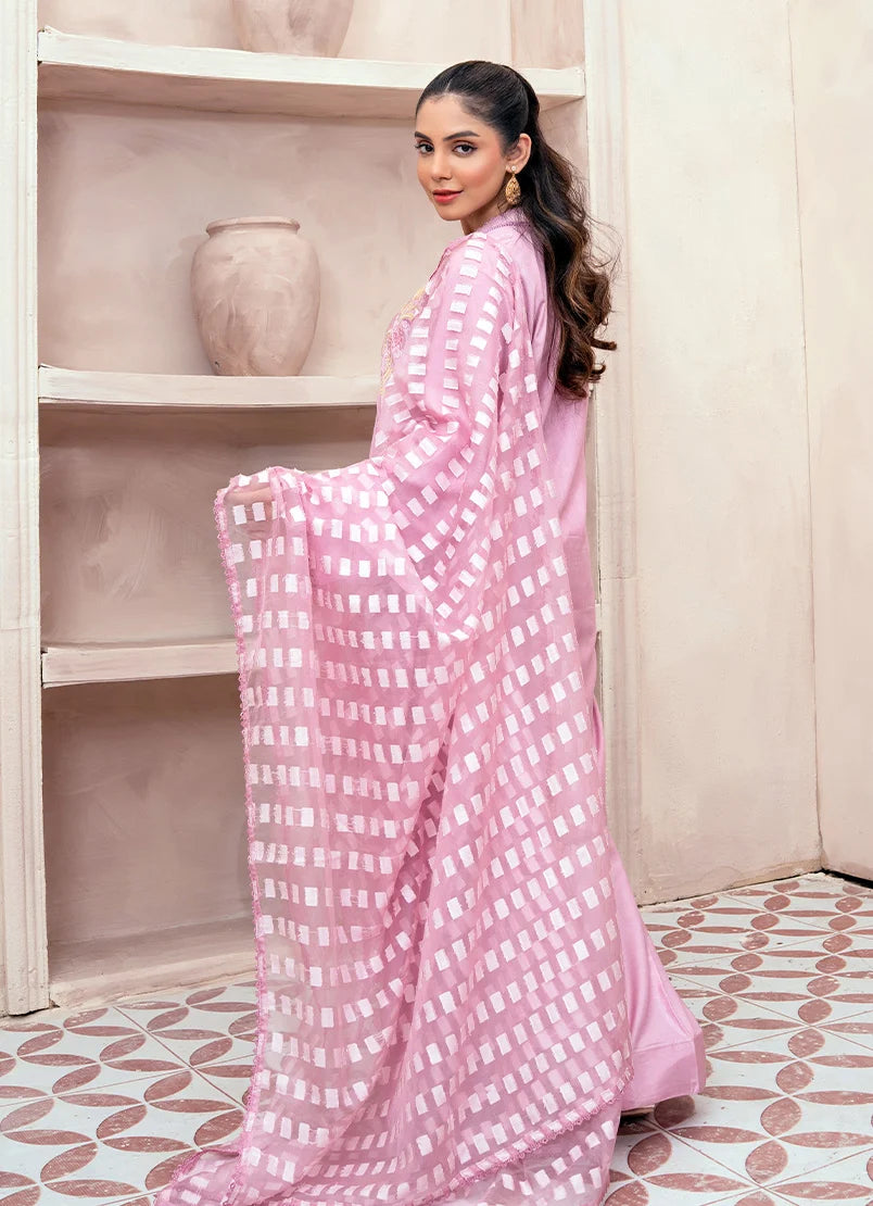 Model wearing pink dress design, side view showing the fall of the raw silk 3-piece set, Buraqstore