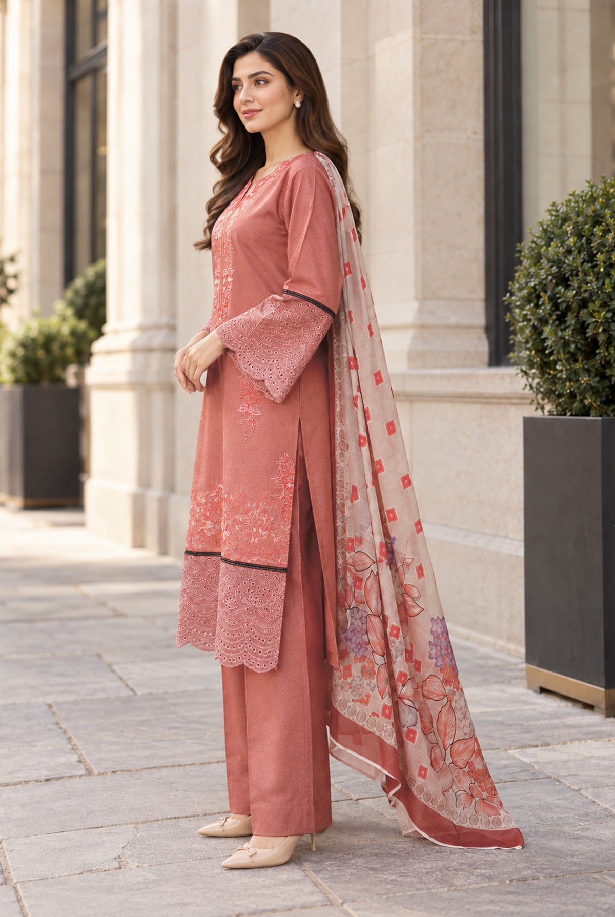 Model wearing pink karandi fabric for ladies with plain dyed karandi trouser, side view of unstitched 3PC at Buraqstore