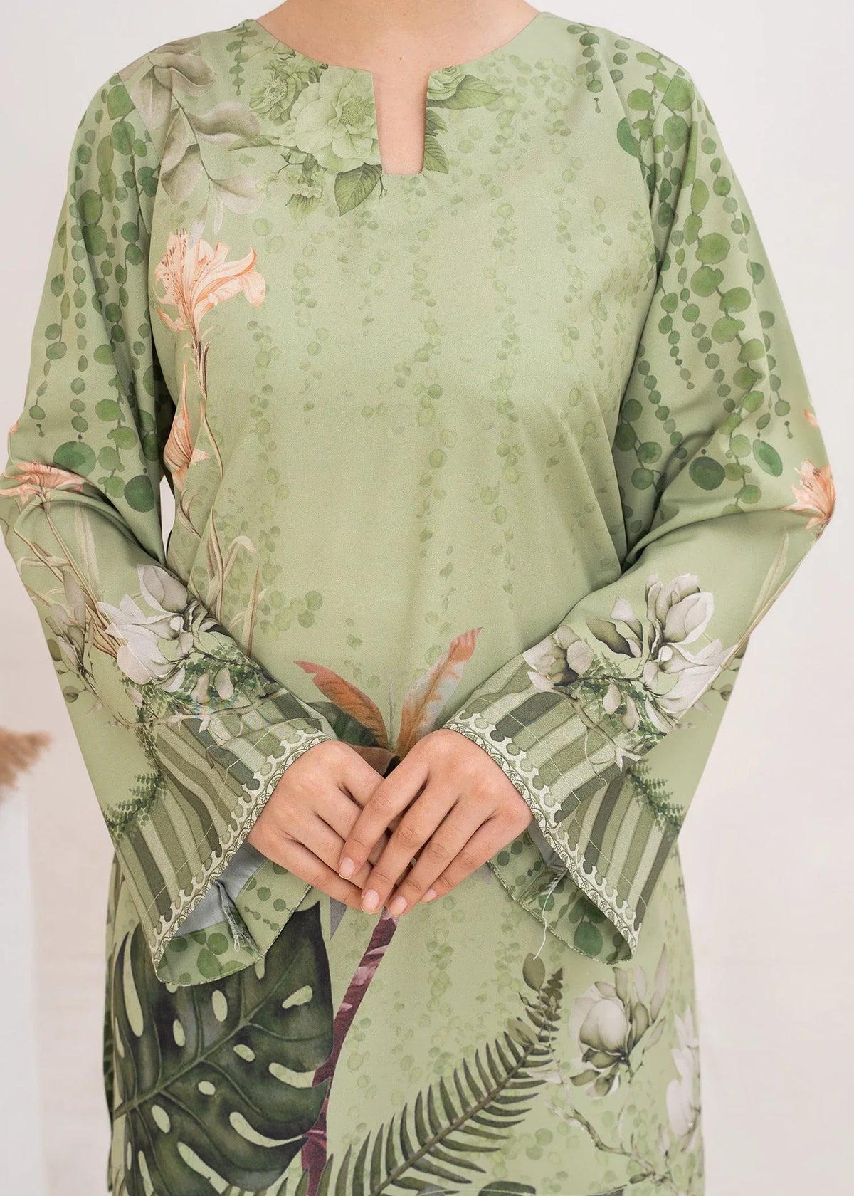 Model wearing pistachio green co ord set women, side view showing the fit of the printed grip set, Buraqstore