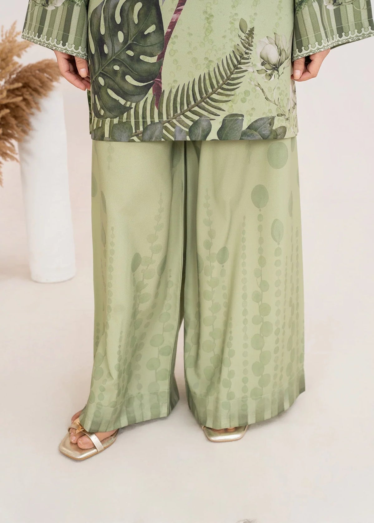 Women wearing pistachio green co ord set women, close-up of the print on the grip top and bottom, Buraqstore