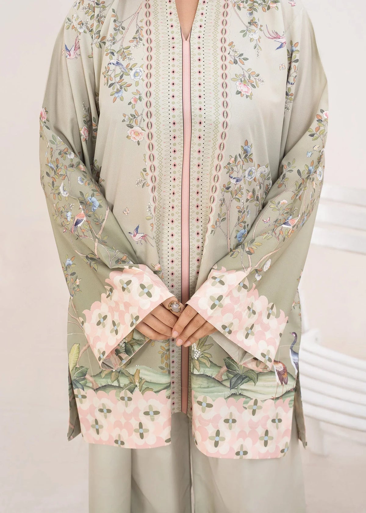 Model wearing green dress design, side view showing the fit of the printed poly lawn 2PC, Buraqstore