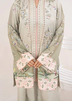 Model wearing green dress design, side view showing the fit of the printed poly lawn 2PC, Buraqstore