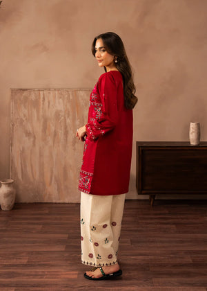 Women wearing red colour dress, close-up of the embroidery on the white lawn shirt, Buraqstore