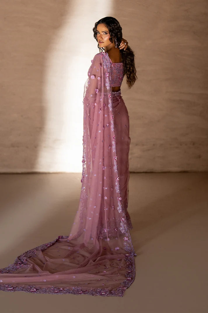 Model wearing rose pink pakistani designer saree, close-up of handcrafted embroidery and 3D floral embellishment on the net, Buraqstore