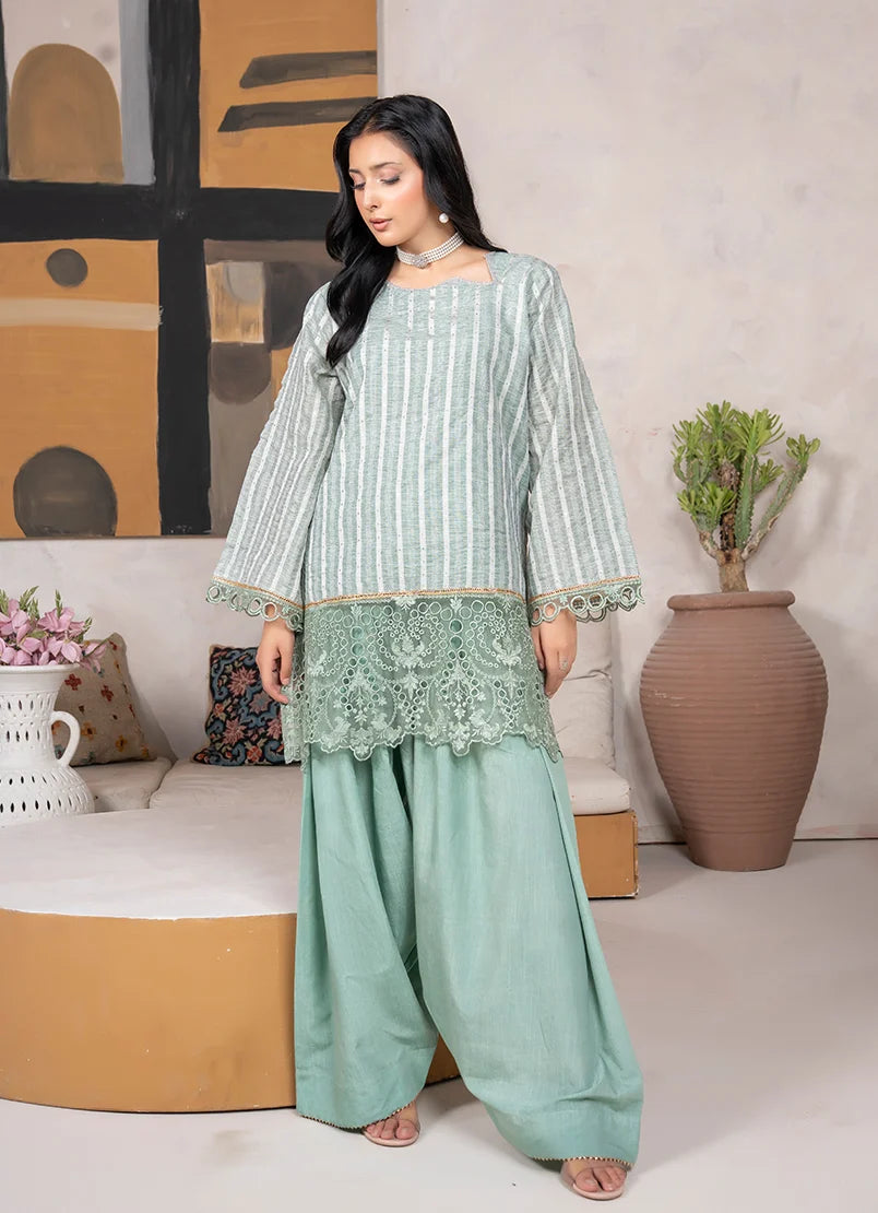 Model wearing sage green dress, side view showing the fit of the jacquard 2-piece set, Buraqstore