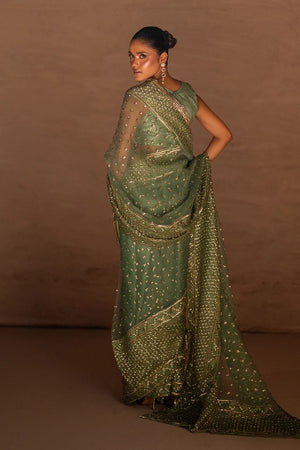 Model wearing sage green saree online pakistan, close-up of sequins and metallic sparkle work on the organza, Buraqstore