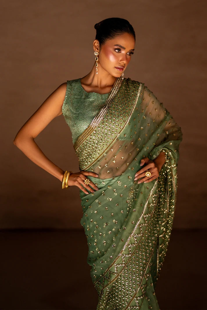 Women wearing sage green saree online pakistan with matching organza blouse, side view of the 2PC at Buraqstore