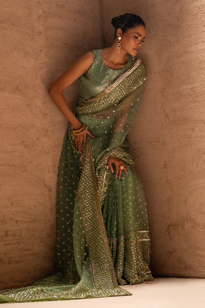 Model wearing sage green saree online pakistan, back view of the draped organza saree and blouse, Buraqstore