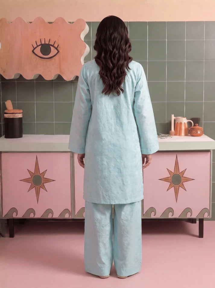 Model wearing sky blue color dress, side view showing the fit of the shirt and trouser 2PC, Buraqstore