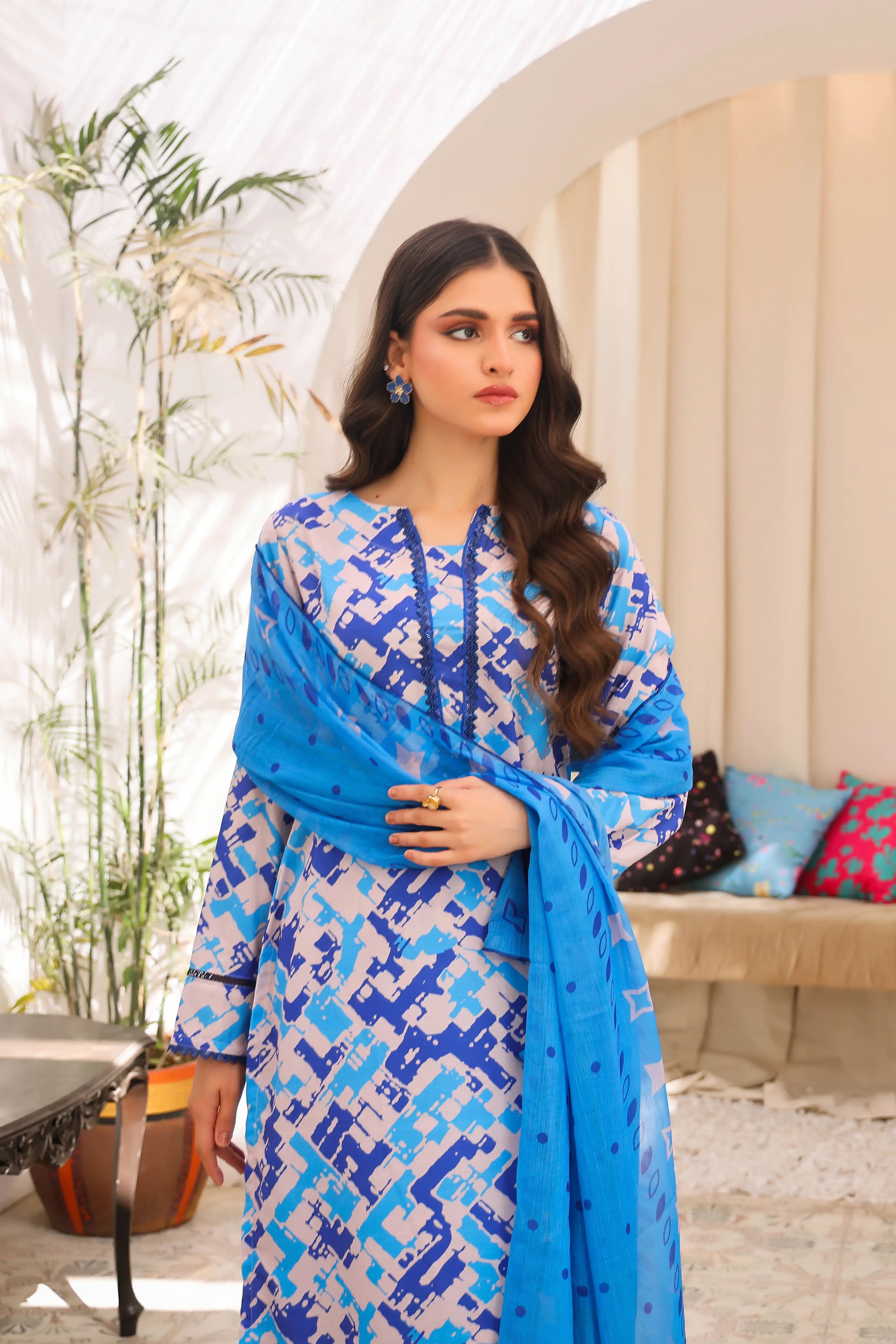 woman wearing sky blue color dress by Buraqstore casual Pakistani wear