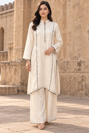A girl dressed in linen shirt design for girl 2PC, stitched dyed linen shirt with matching trouser, front view from Buraqstore