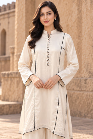 Model wearing linen shirt design for girl 2PC in side profile showing the comfortable fit, stitched dyed linen at Buraqstore