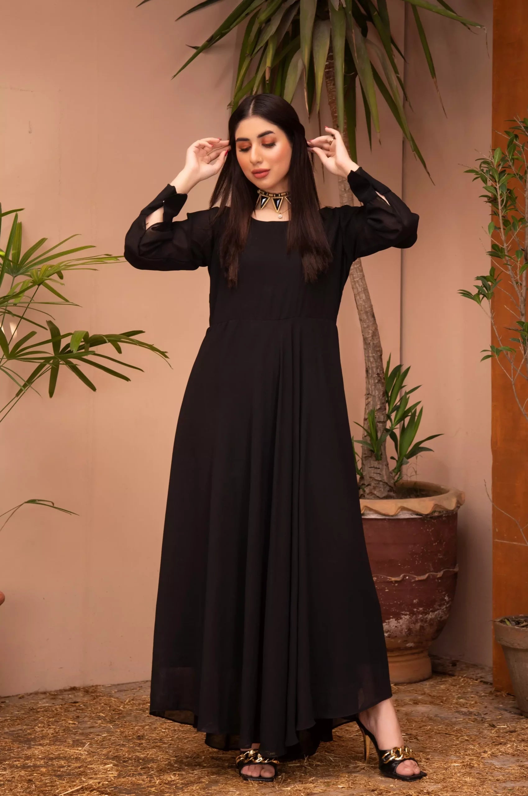 girl posing in black dress buraqstore with modern tailored fit