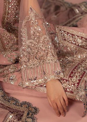 Women wearing tea pink color dress, net dupatta draped over the shoulder, Buraqstore