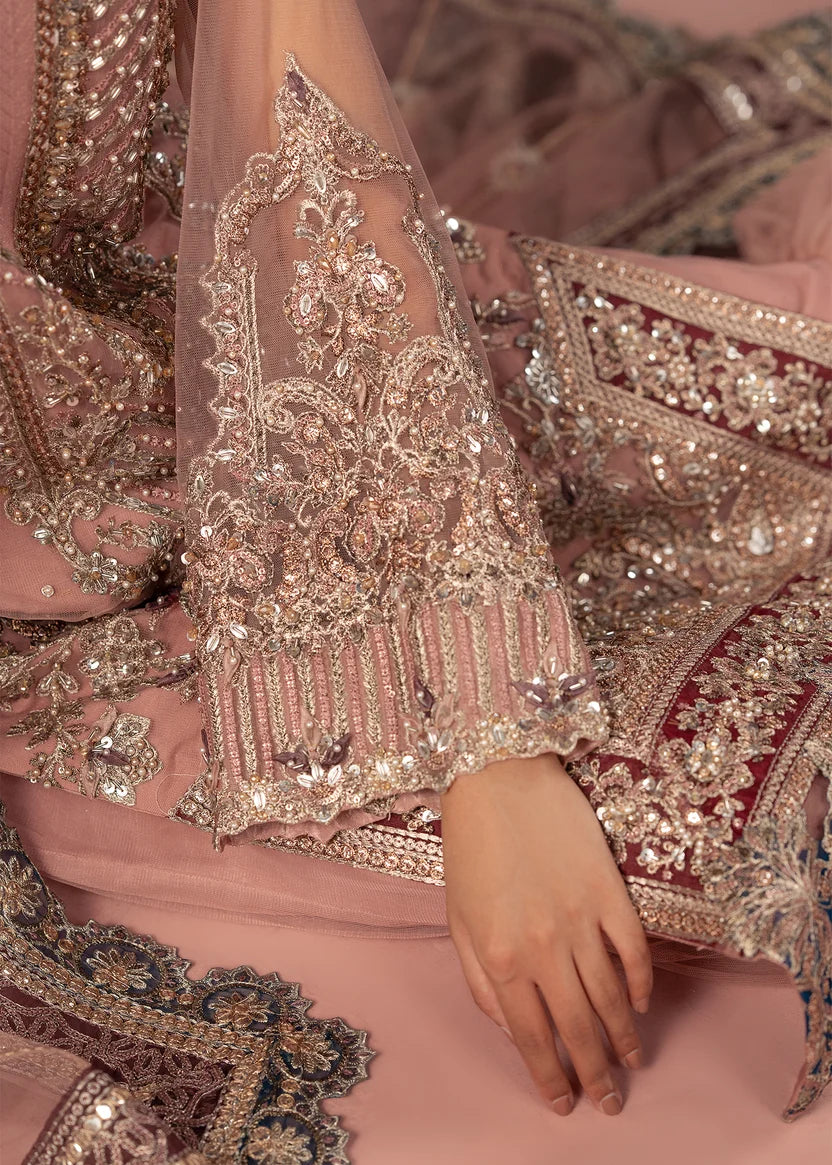 Women wearing tea pink color dress, net dupatta draped over the shoulder, Buraqstore