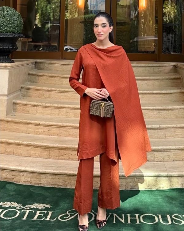 Model wearing terracotta rust dress, an Irish pashmina shirt and trouser 3PC set, front view from Buraqstore