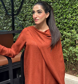 Women wearing terracotta rust dress, close-up of the soft pashmina fabric texture, Buraqstore