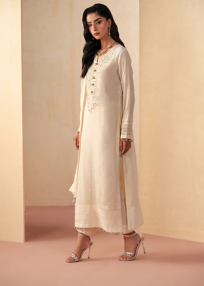 Model wearing white dress design, an embroidered and embellished chiffon shirt with grip trouser, front view from Buraqstore