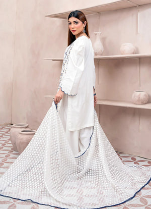 Women wearing white dress designs pakistani, close-up of the embroidery on the raw silk shirt, Buraqstore