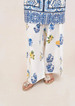 Model wearing white co ord set design, side view showing the fit of the printed grip set, Buraqstore