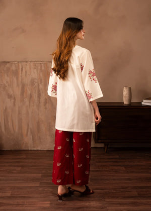 Women wearing red dress design, close-up of the red embroidery on the white lawn shirt, Buraqstore