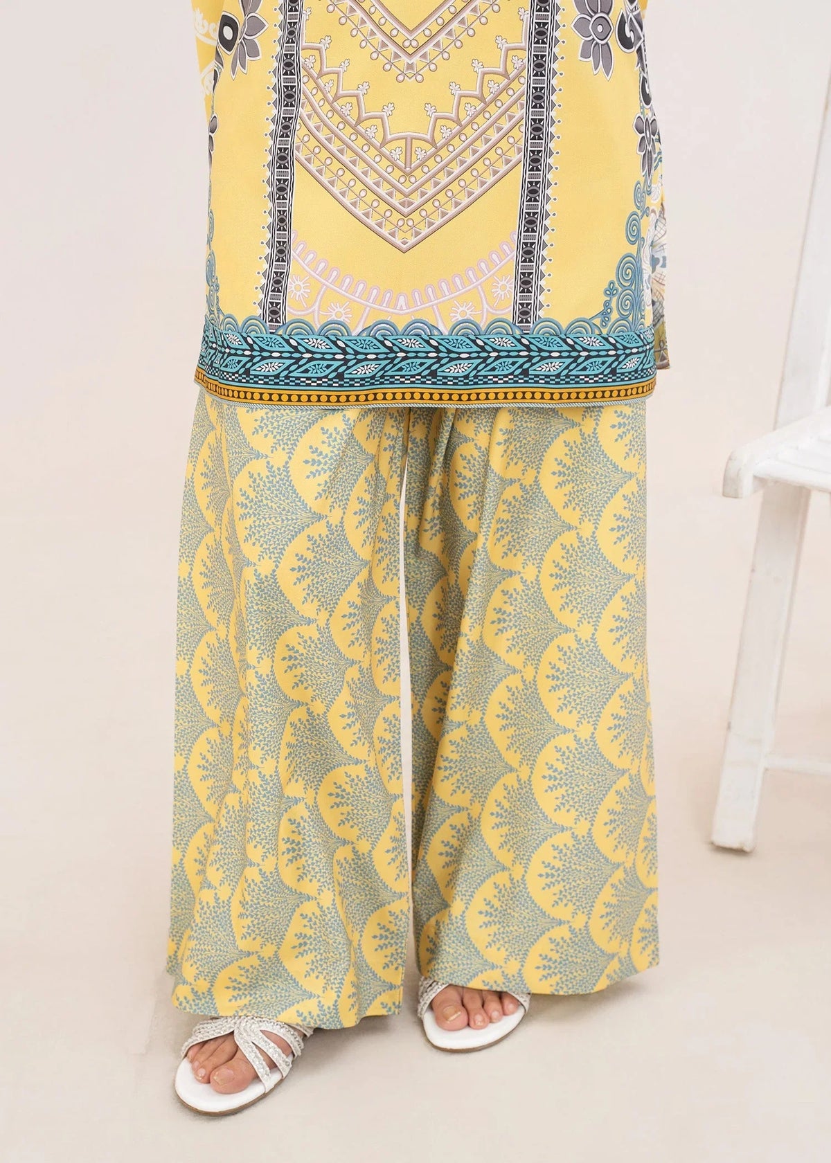 Women wearing yellow 2 piece co ord set Pakistan as a casual outfit, shop printed grip 2-piece online at Buraqstore